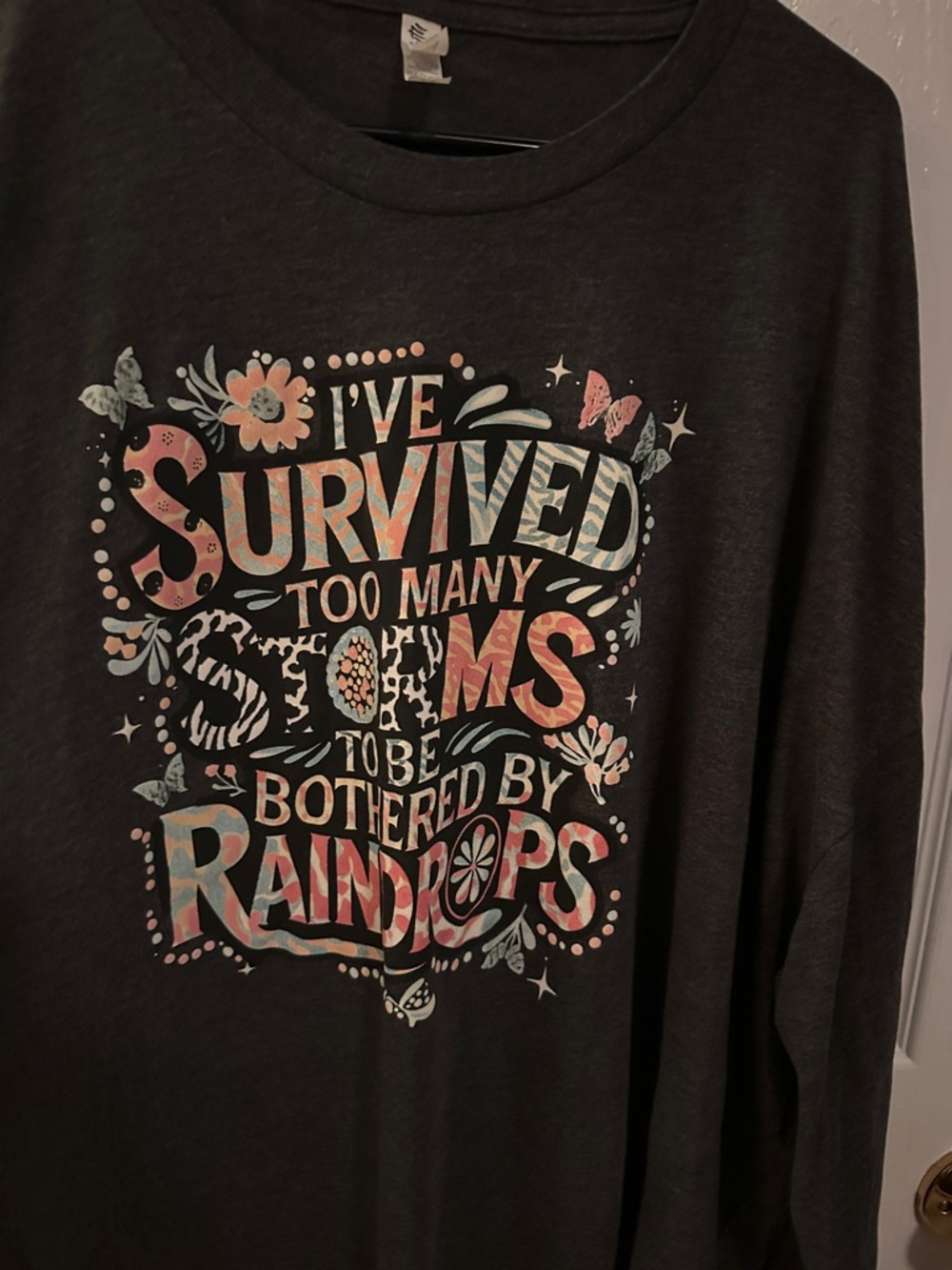 Women's Dark Gray Long Sleeve Graphic Tee - 'I've Survived Too Many Storms'